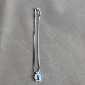 Silver-toned necklace with oval pendant